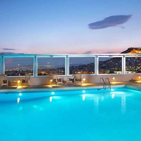 Divani Caravel Athens Exterior photo The pool at the hotel